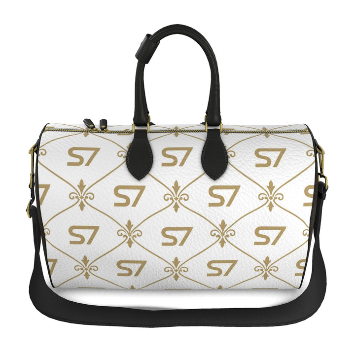 S7 Champagne Royale duffle bag with a white body, champagne-gold S7 monograms and ornate lattice, chocolate-brown sides, and black handles.