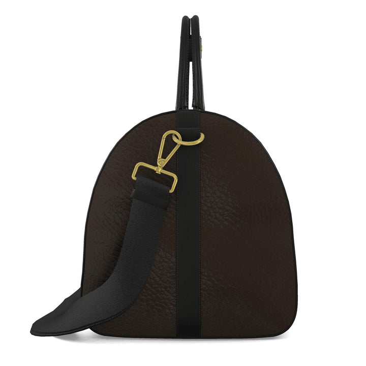 side view of duffle bag and shoulder strap in brown with black accents.