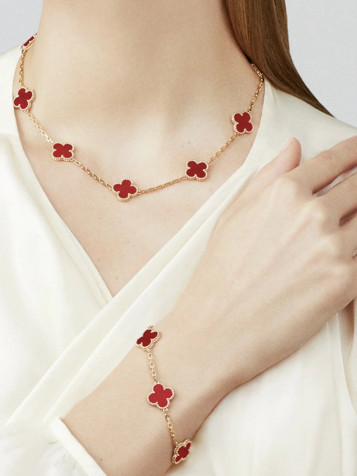 Van Cleef & Arpels Vintage Alhambra bracelet, 5 motifs 18K yellow gold, Carnelian worn with matching necklace.