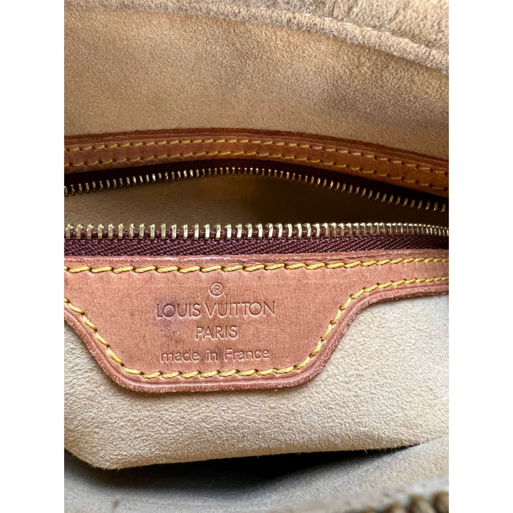 Inside view of LOUIS VUITTON Looping GM Monogram Shoulder Bag showcasing authentic label and zipper.