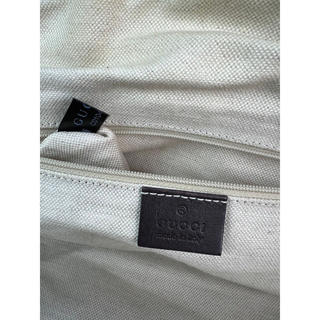 Close-up of a Gucci bag with visible branding on a white background