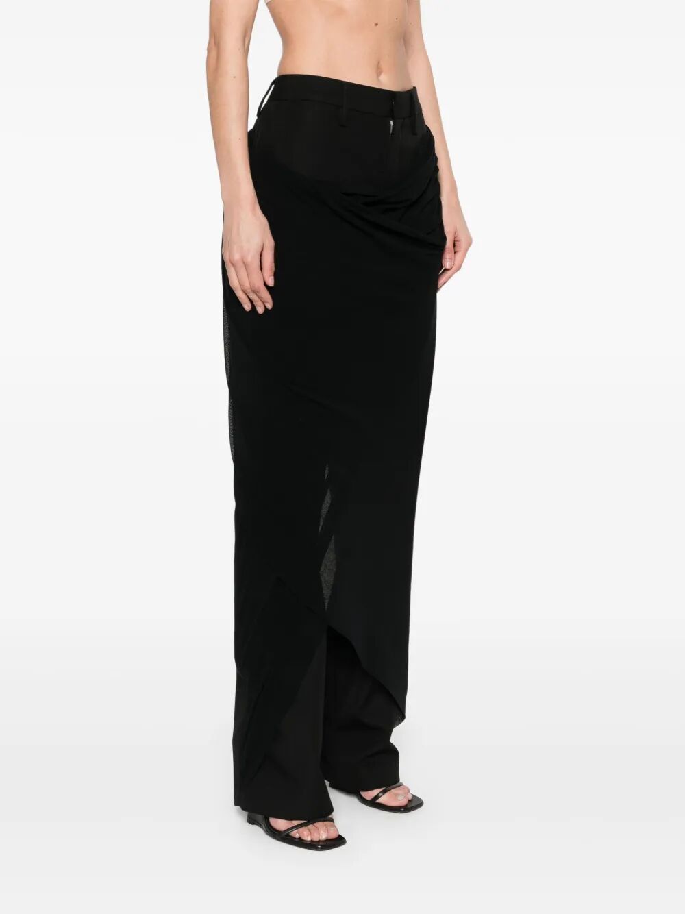 Person wearing a black skirt on a white background