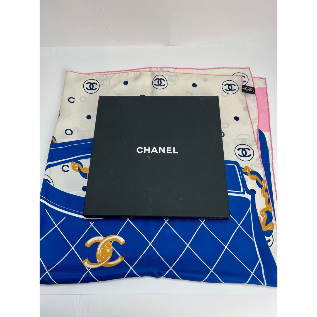 Chanel scarf with a black square in the center on a white background