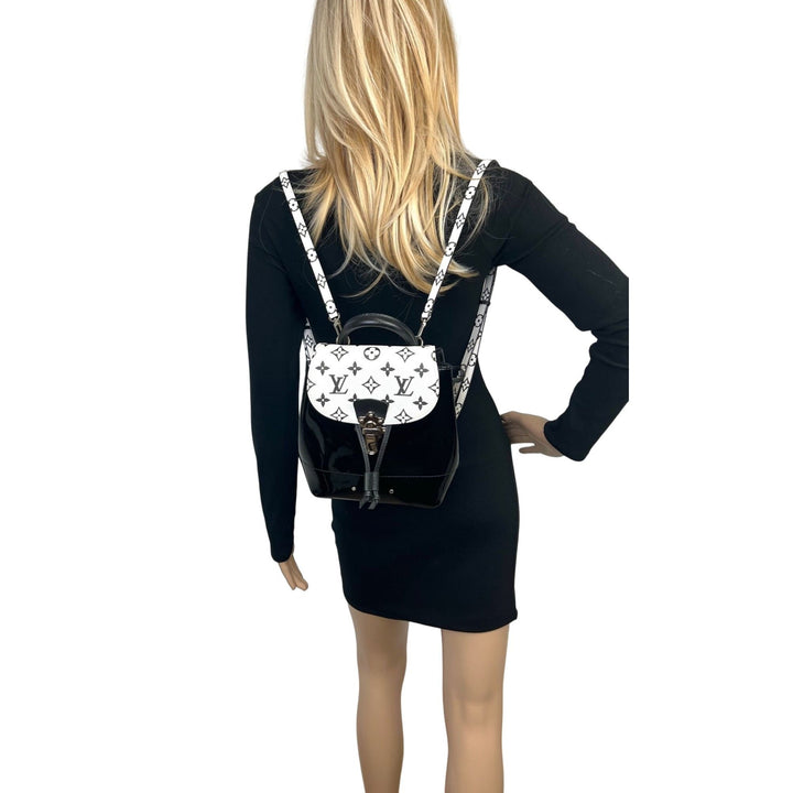 Model wearing LOUIS VUITTON Hot Springs Backpack White Monogram and Patent Leather, showcasing luxury bags style.