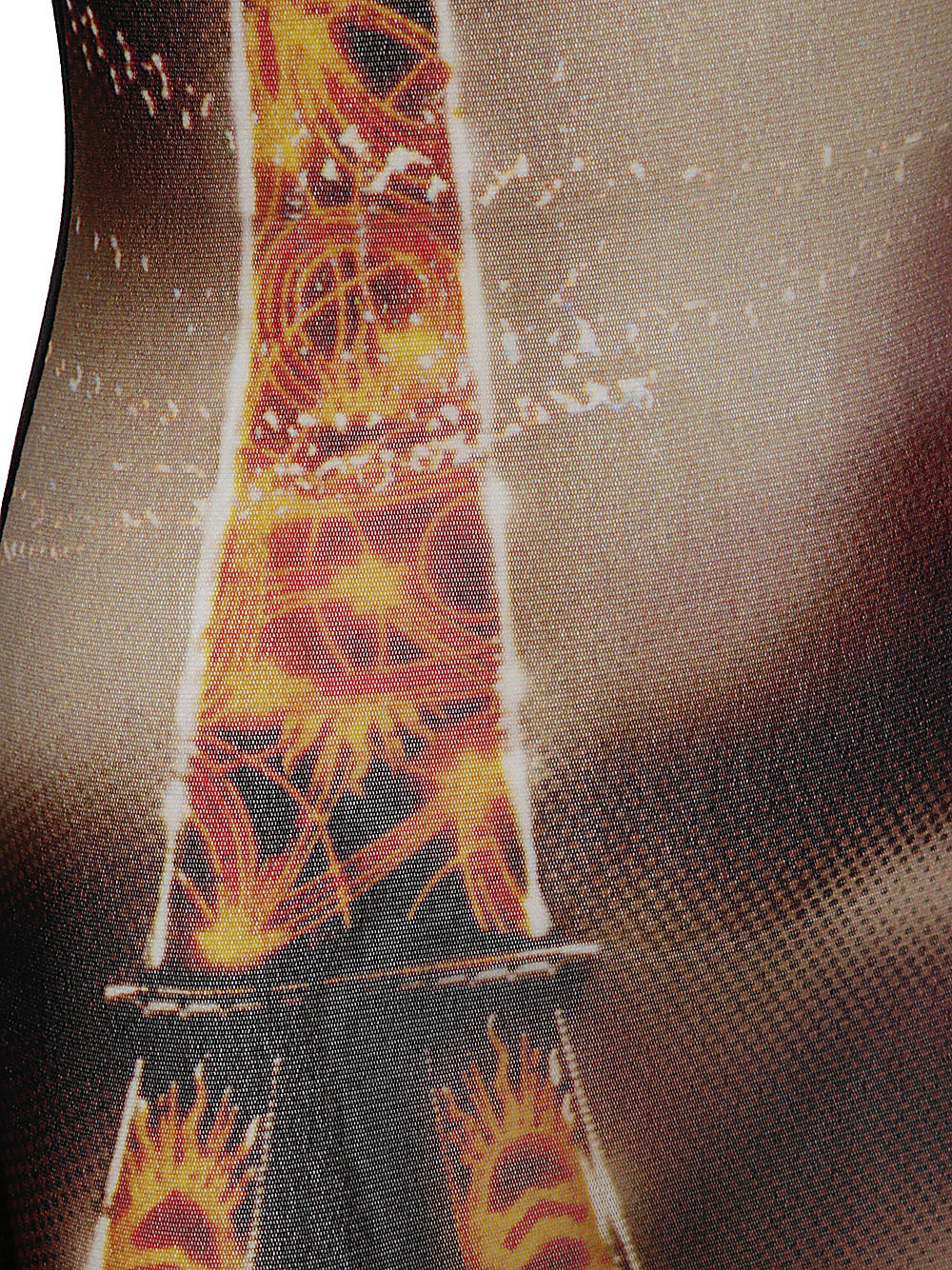 Close-up of a fabric with a fiery design on a textured background