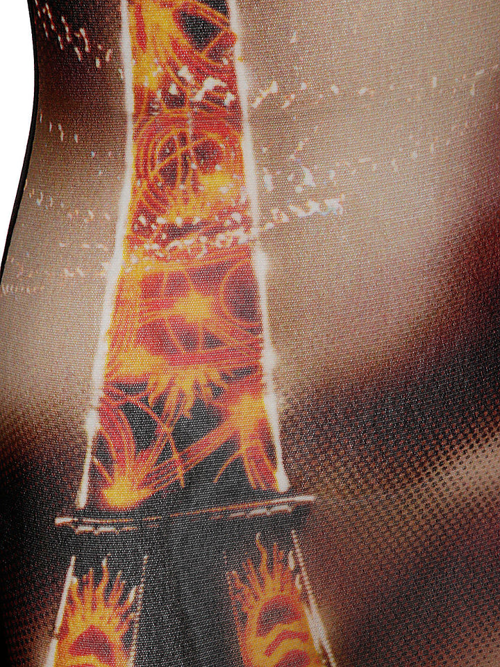 Close-up of a fabric with a fiery design on a textured background