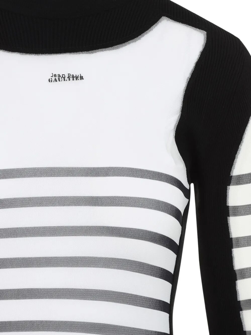 Black and white striped garment with 'John Galliano' branding on a plain background