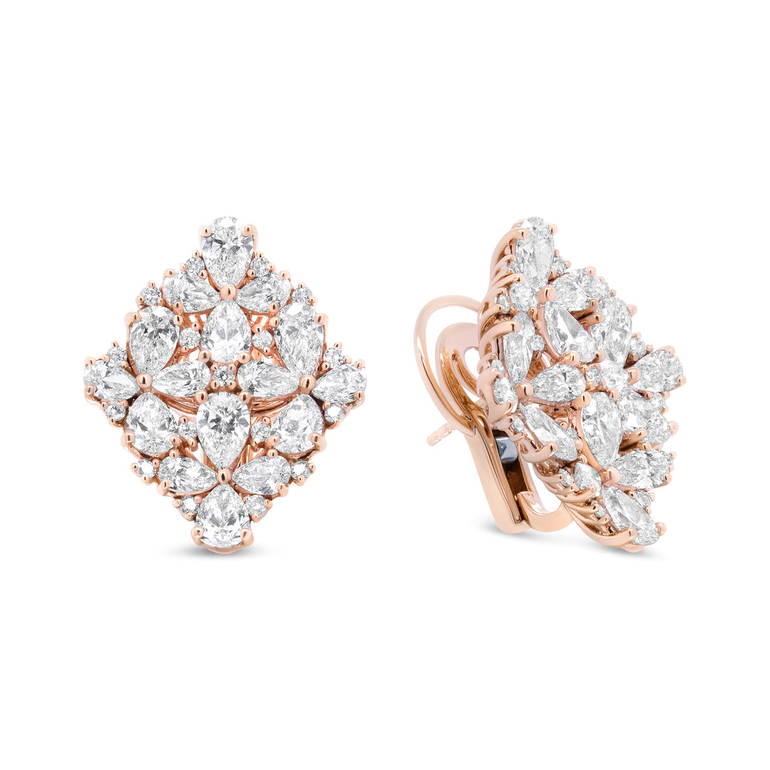 Rose gold earrings with diamond-like stones on a white background