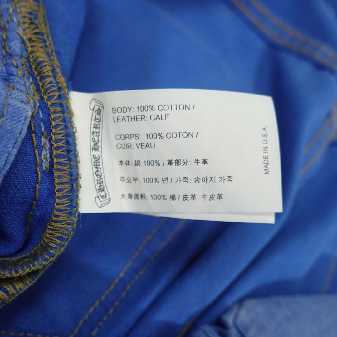 Chrome Hearts Levis Cross Patch Jeans in Blue care label showing 100% cotton composition, emphasizing rarity and authenticity of luxury denim jeans.