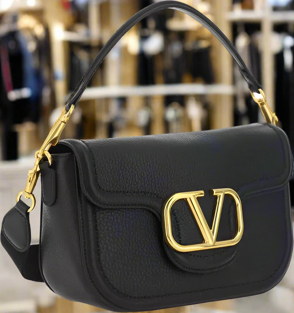 Valentino Garavani women's designer handbag in leather Luxury Valentino Garavani shoulder bag with iconic studs Valentino Garavani crossbody bag in black with gold accents