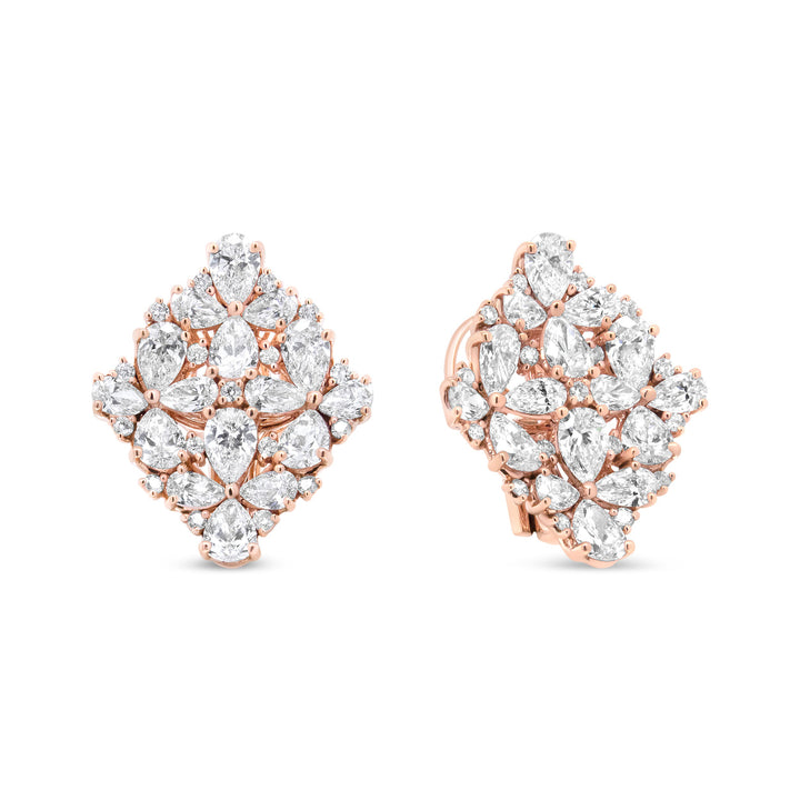 Rose gold earrings with clear gemstones on a white background