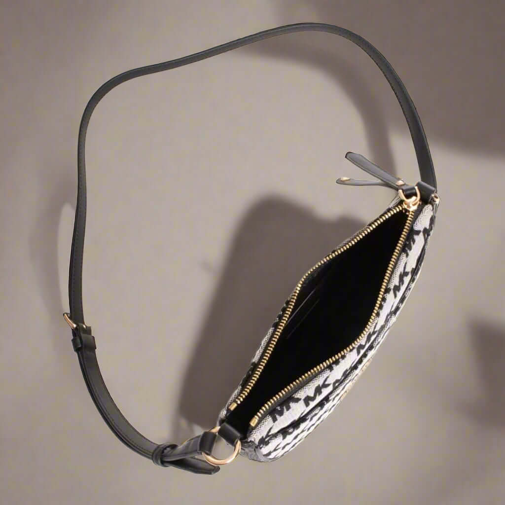 Fanny pack with floral pattern and black strap on a white background