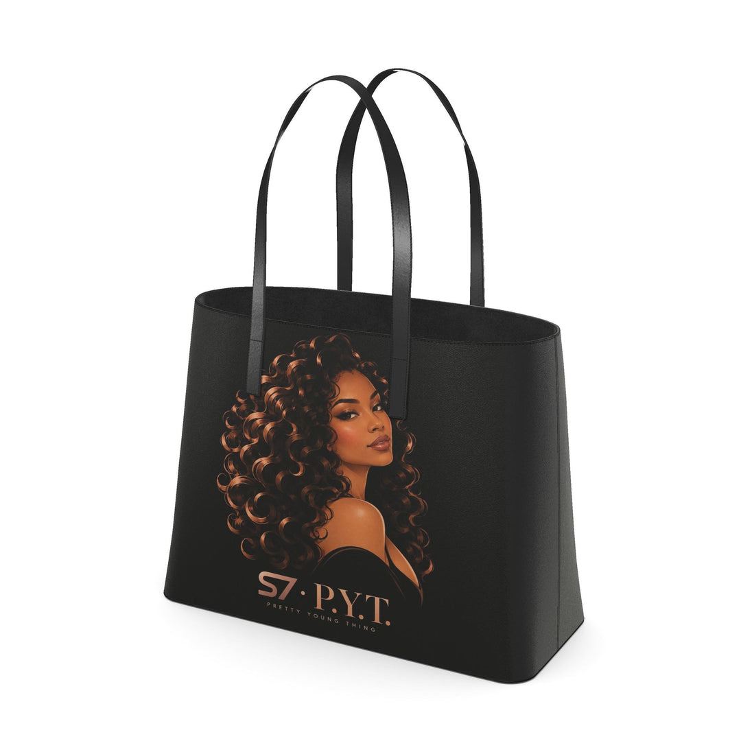 Black S7 P.Y.T. leather tote featuring a copper-toned illustration of a curly-haired woman and rose-gold S7 branding.