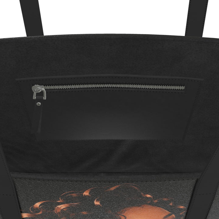 Black S7 P.Y.T. leather tote featuring a copper-toned illustration of a curly-haired woman and rose-gold S7 branding.