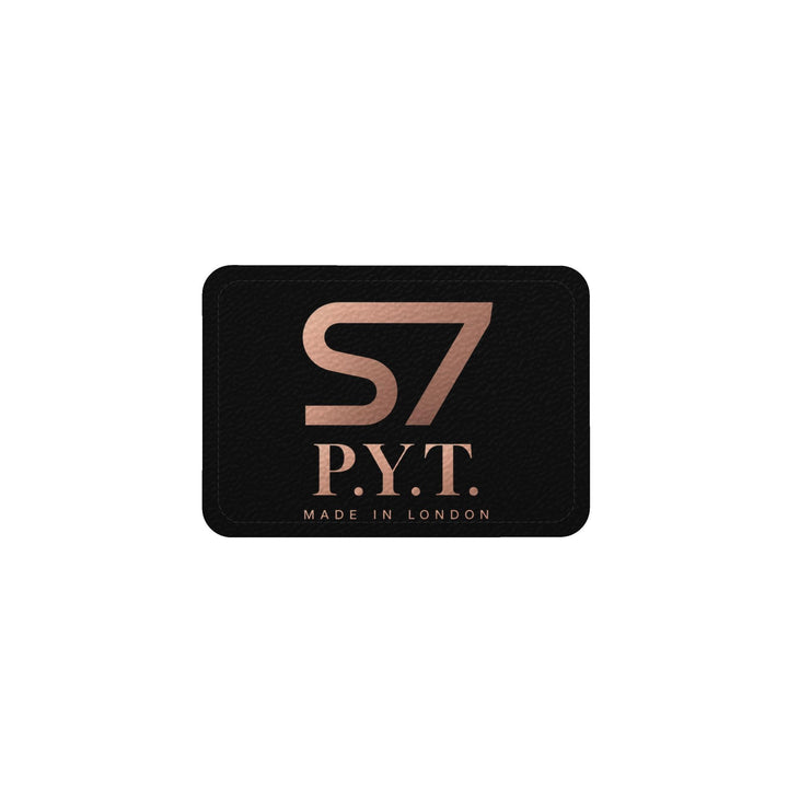 Black S7 P.Y.T. leather tote featuring a copper-toned illustration of a curly-haired woman and rose-gold S7 branding.