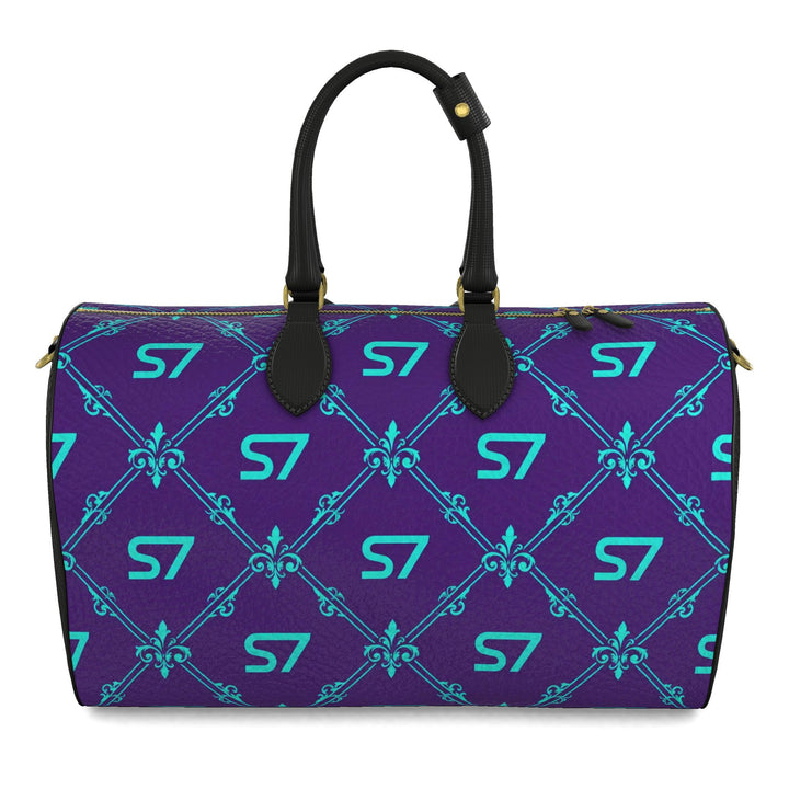 S7 Amethyst Royale purple leather duffle bag with turquoise monograms and ornate diamond lattice, black handles and side panels, and gold-tone hardware.