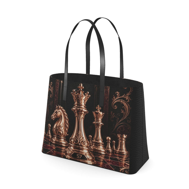 S7 Sovereign black leather tote featuring rose-gold-tone chess pieces, an ornate burgundy chessboard, and black handles.