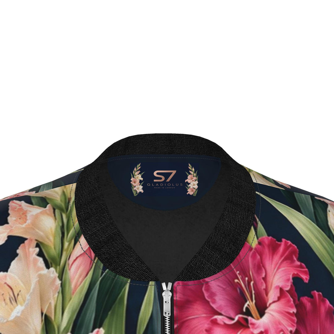 S7 Gladiolus women’s satin bomber jacket with pink, coral, ivory, and plum flowers on midnight navy and contrasting black trim.