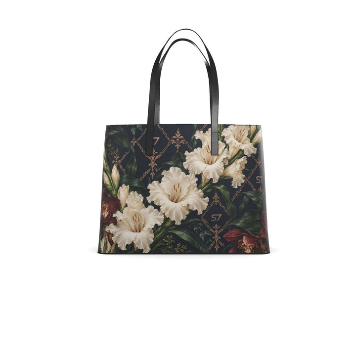 S7 Midnight Conservatory leather tote with ivory gladiolus, burgundy orchids and rose-gold monogram lattice on midnight navy.