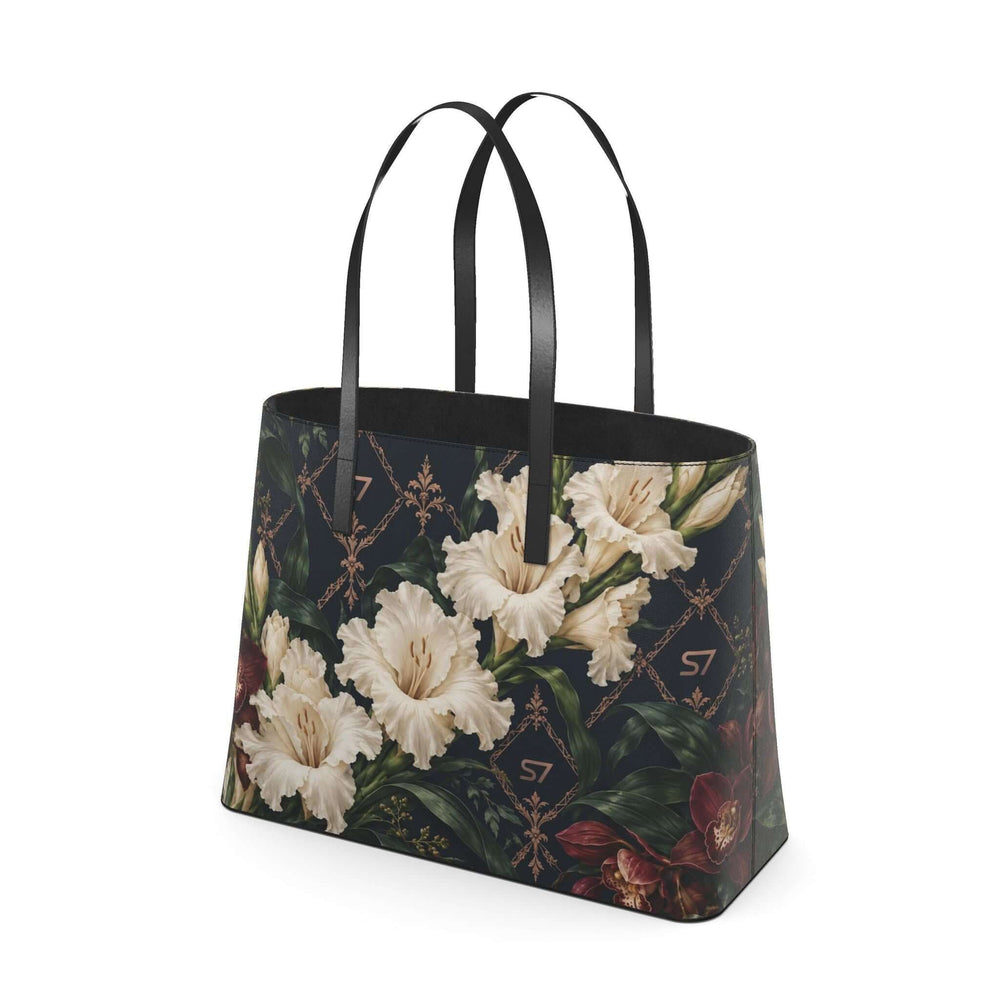 S7 Midnight Conservatory leather tote with ivory gladiolus, burgundy orchids and rose-gold monogram lattice on midnight navy.