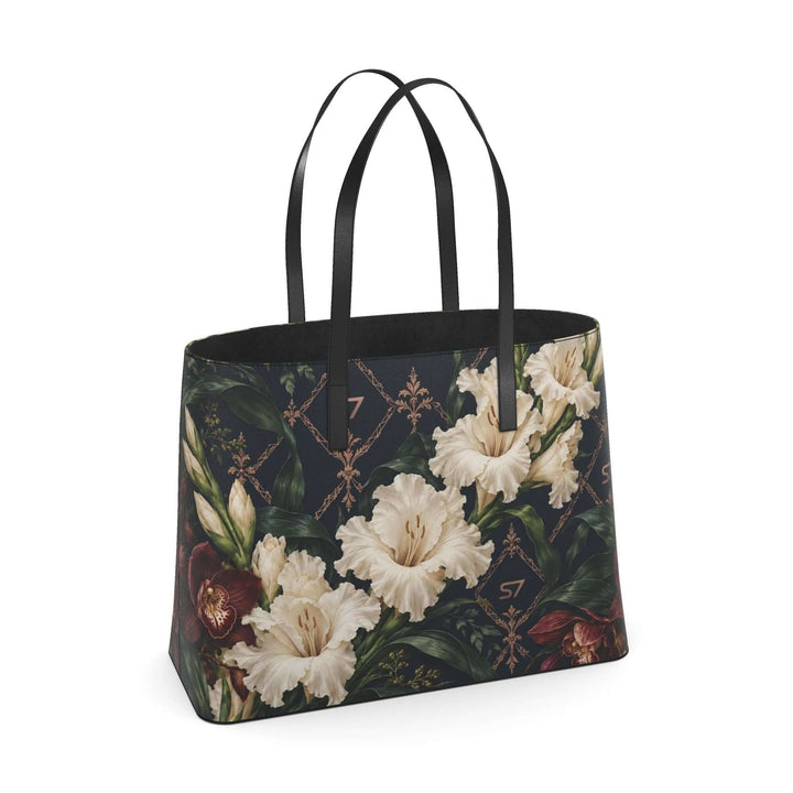 S7 Midnight Conservatory leather tote with ivory gladiolus, burgundy orchids and rose-gold monogram lattice on midnight navy.