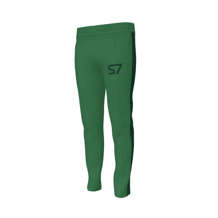 S7 Heritage Green tracksuit pants with a dark forest-green upper-thigh logo and matching stripes down the outer legs.