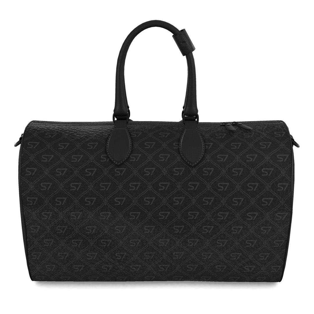 S7 Phantom leather duffle bag featuring near-black charcoal S7 monograms and a tight ornate diamond lattice over a deep-black background.