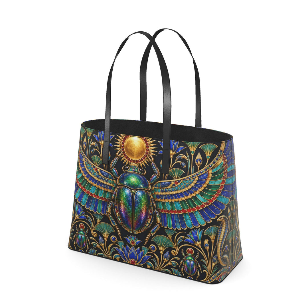 S7 KHEPRI Scarab Royale tote bag with colorful winged scarab artwork, Egyptian-inspired gold detailing, and black handles.