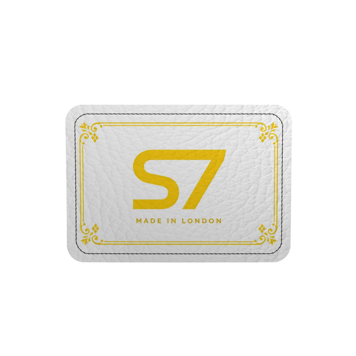S7 Riviera Soleil duffle bag featuring bright yellow S7 monograms and ornate diamond lattice on a white background.