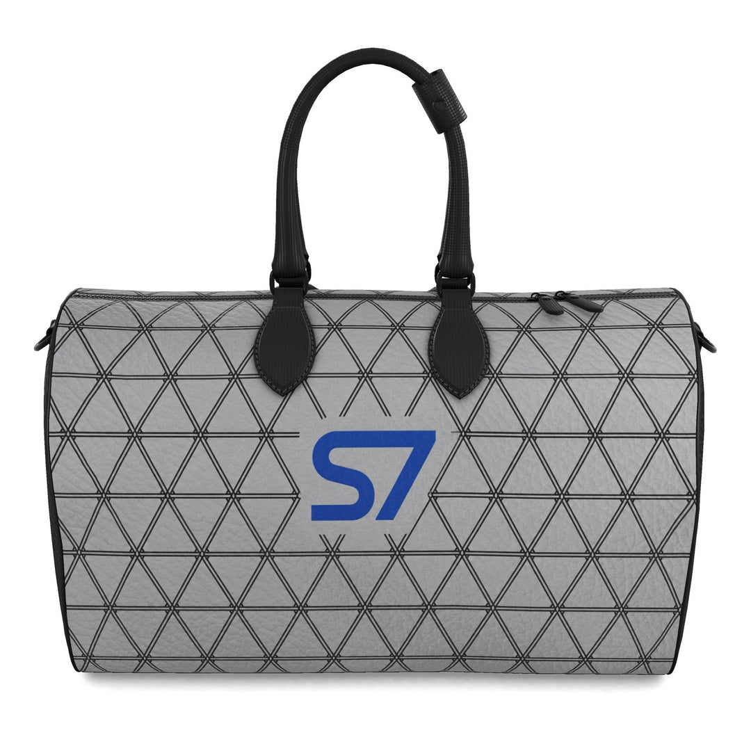 S7 PRISM duffle bag featuring black triangular lattice on a heather-gray background with a single cobalt-blue S7 logo.