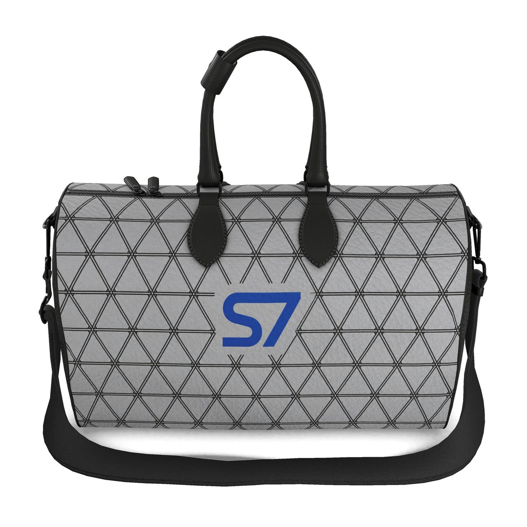 S7 PRISM duffle bag featuring black triangular lattice on a heather-gray background with a single cobalt-blue S7 logo.