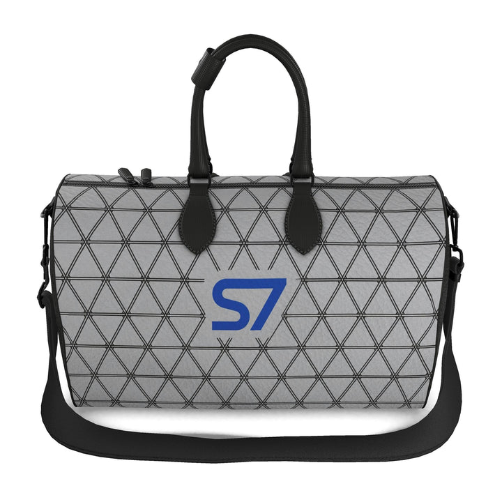 S7 PRISM duffle bag featuring black triangular lattice on a heather-gray background with a single cobalt-blue S7 logo.
