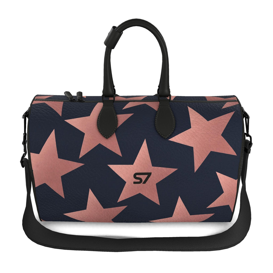 S7 Stella Midnight leather duffle bag with oversized rose-gold stars on midnight blue and a centered black S7 monogram.
