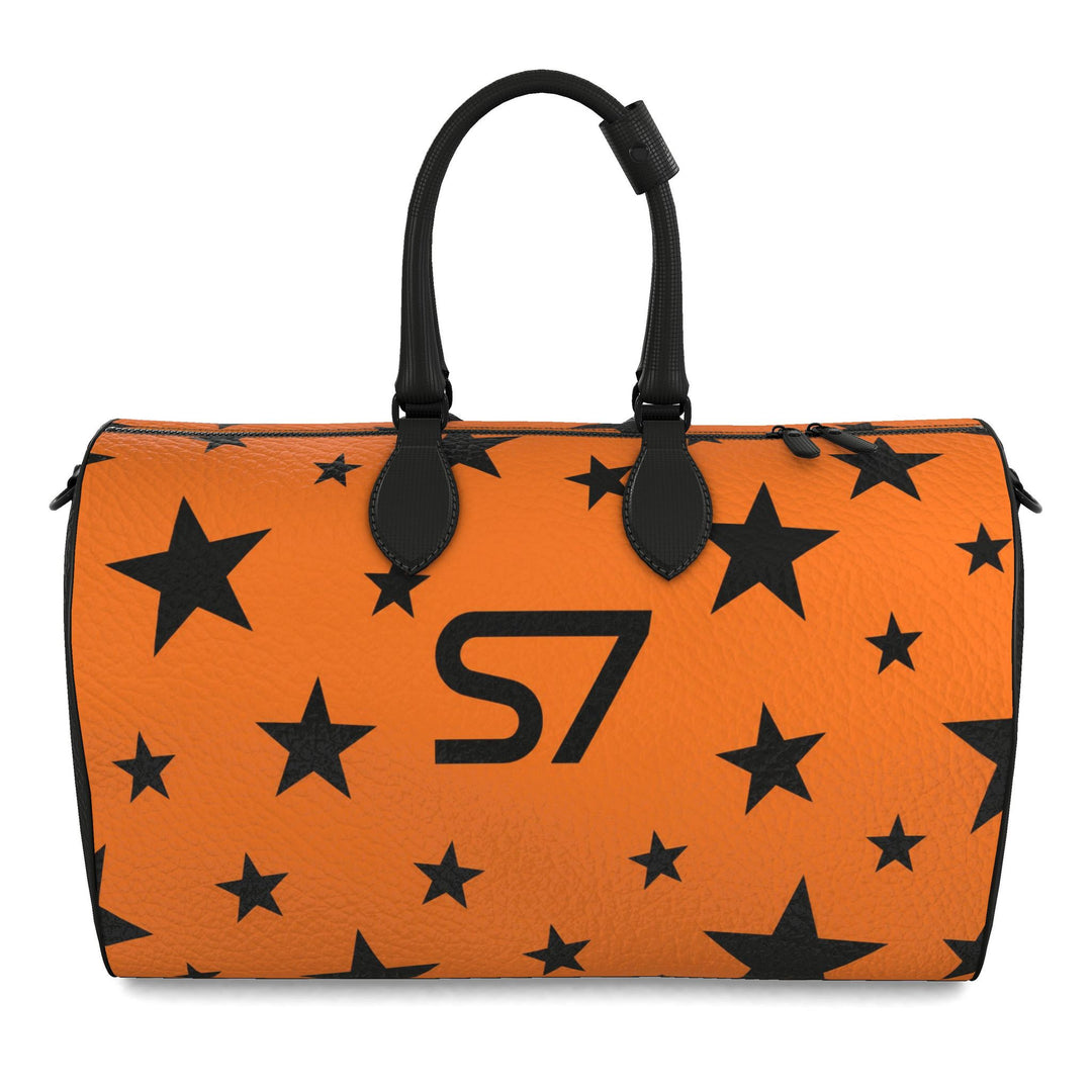 S7 Solar Noir orange leather duffle bag with scattered black five-point stars, a centered black S7 monogram and black handles and end panels.