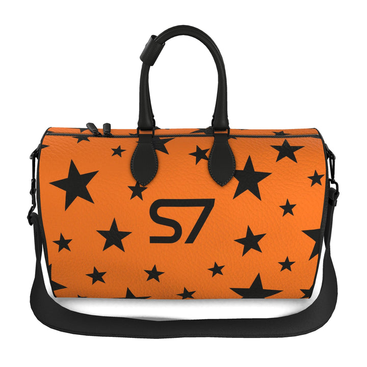 S7 Solar Noir orange leather duffle bag with scattered black five-point stars, a centered black S7 monogram and black handles and end panels.