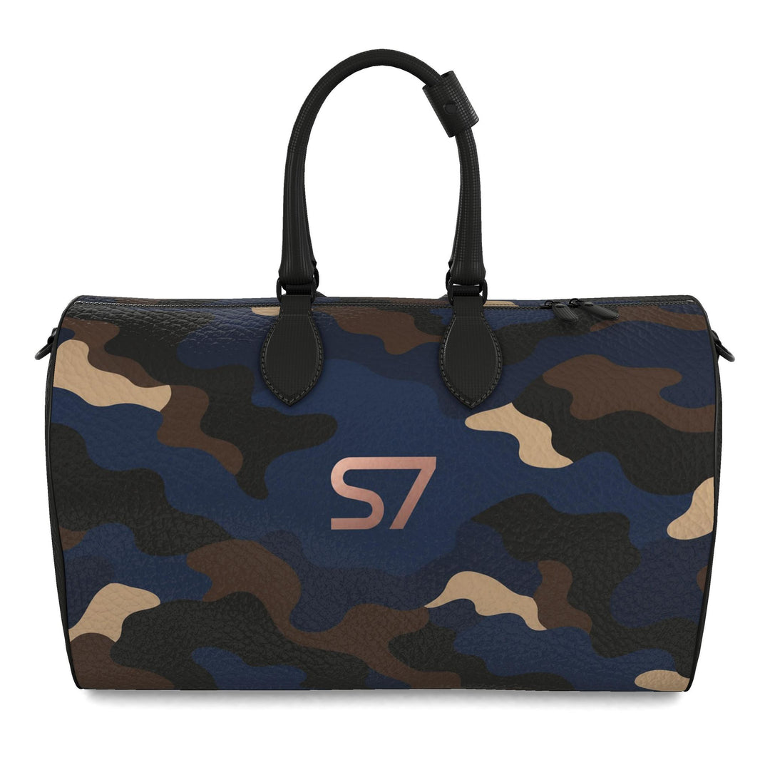 S7 Midnight Terrain leather duffle bag with midnight-blue, navy, beige, brown and black camouflage, a centered rose-gold S7 monogram and black trim.