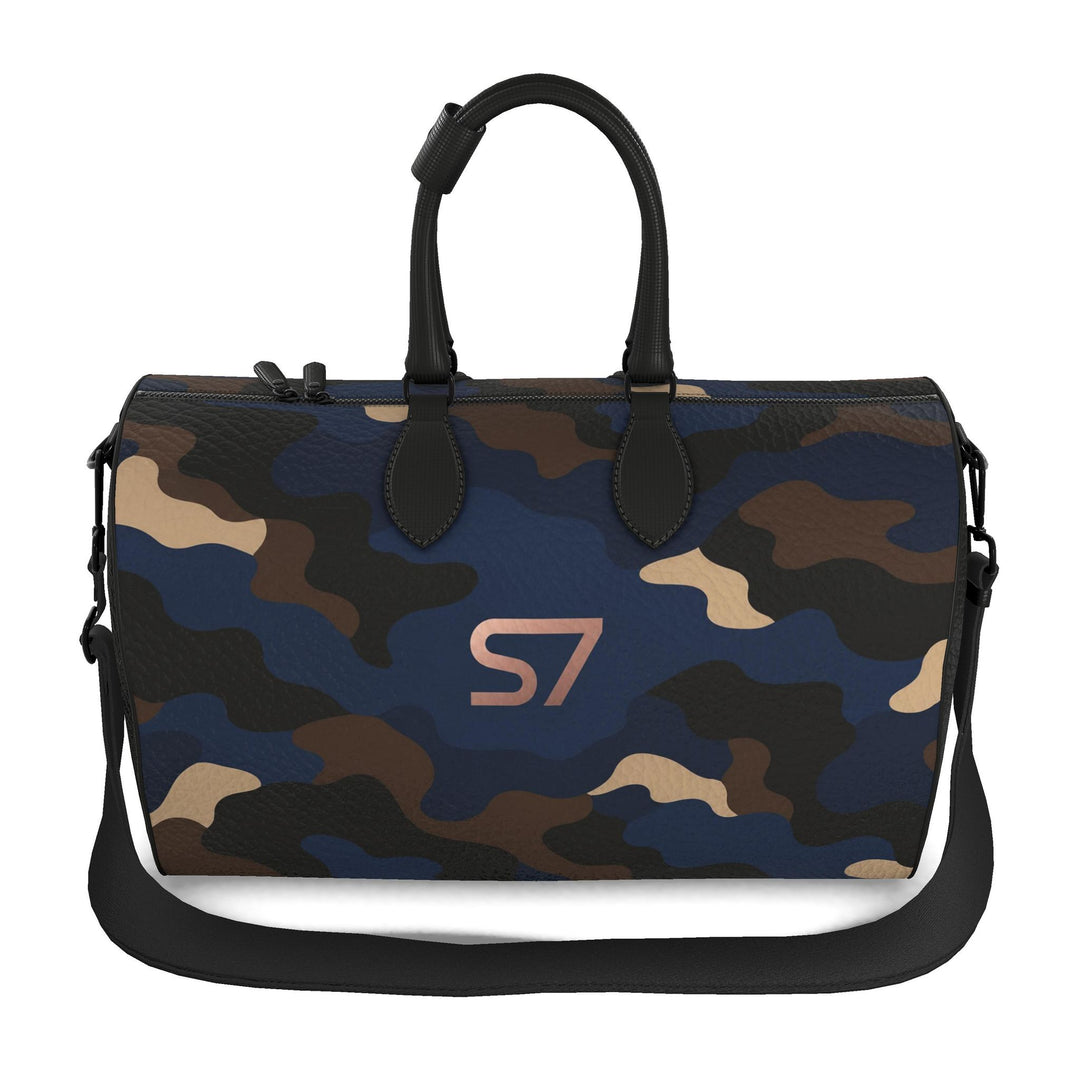 S7 Midnight Terrain leather duffle bag with midnight-blue, navy, beige, brown and black camouflage, a centered rose-gold S7 monogram and black trim.