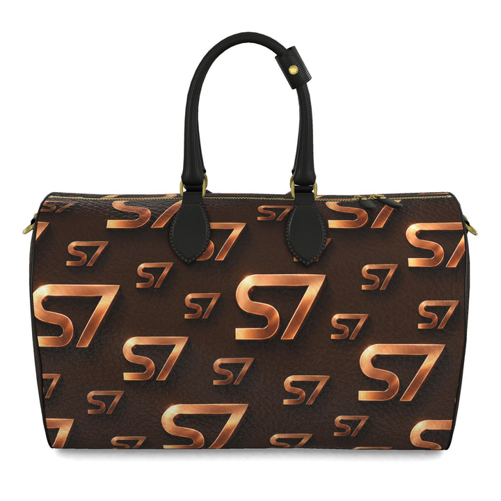 S7 Molten Copper bag with dimensional copper monogram print, espresso brown side panels, and gold-tone hardware.