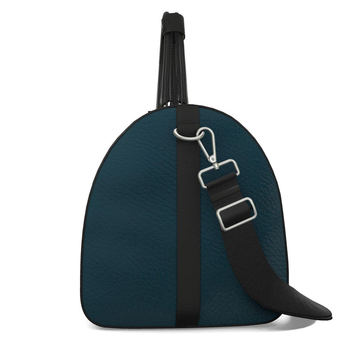 S7 Electric Lagoon bag featuring dimensional turquoise monograms, midnight teal side panels, and nickel-tone hardware.