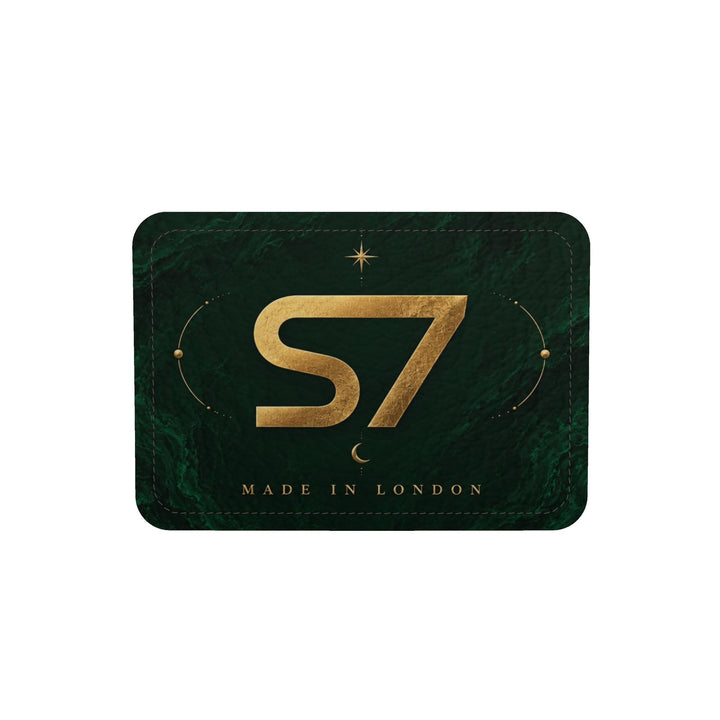 S7 Emerald Tablet bag featuring a gold S7 monogram, celestial sun and crescent moon artwork, and a deep emerald stone-effect background.