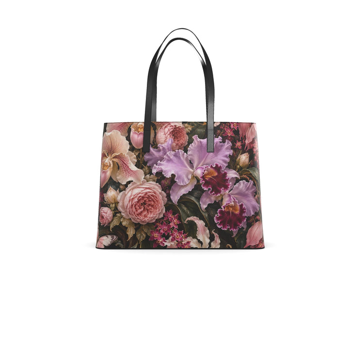 S7 Orchid Reverie leather tote bag featuring blush and lilac flowers, two butterflies, and gold-toned botanical artwork on deep plum with black handles.