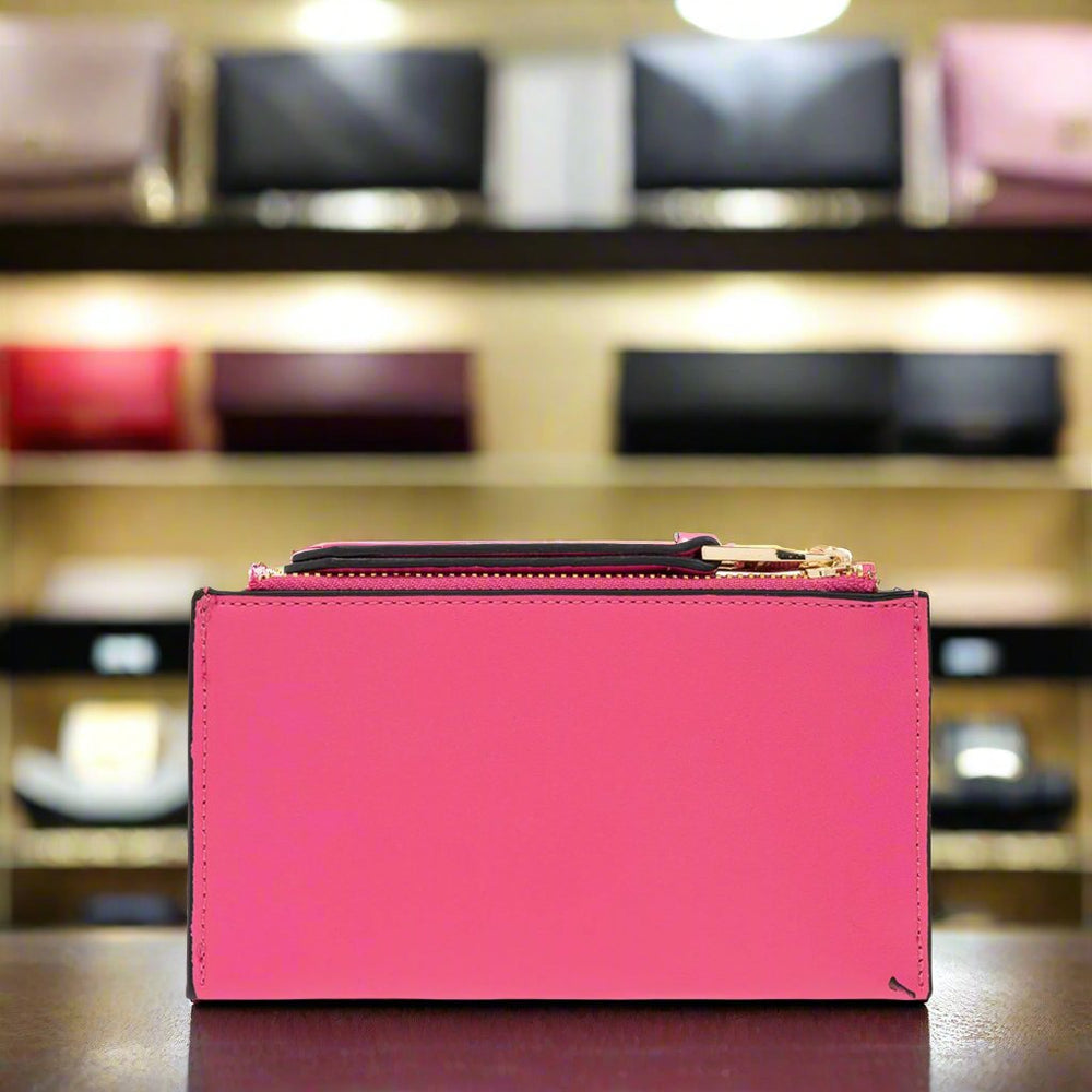 Versace Jeans Couture pink wallet in synthetic leather, features a gold emblem, a stylish accessory for women.