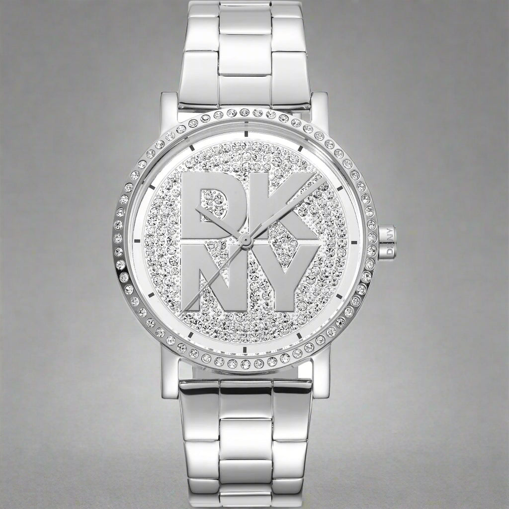 DKNY women's silver tone center logo Watches with jeweled bezel