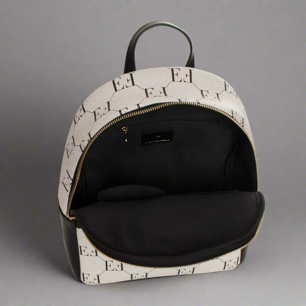 Backpack with black interior and patterned exterior on a white background