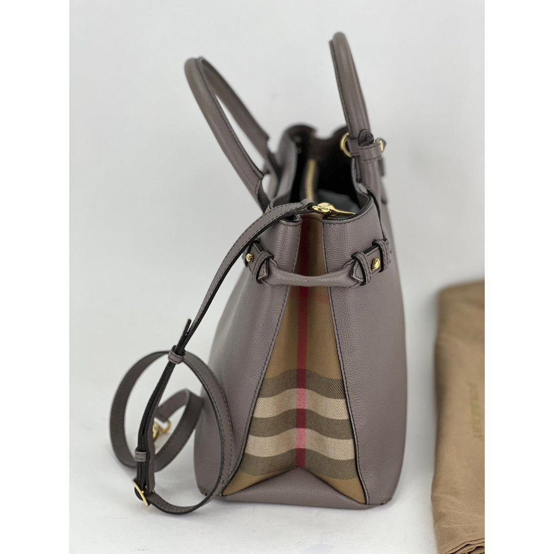 Gray handbag with a checkered pattern on a white background