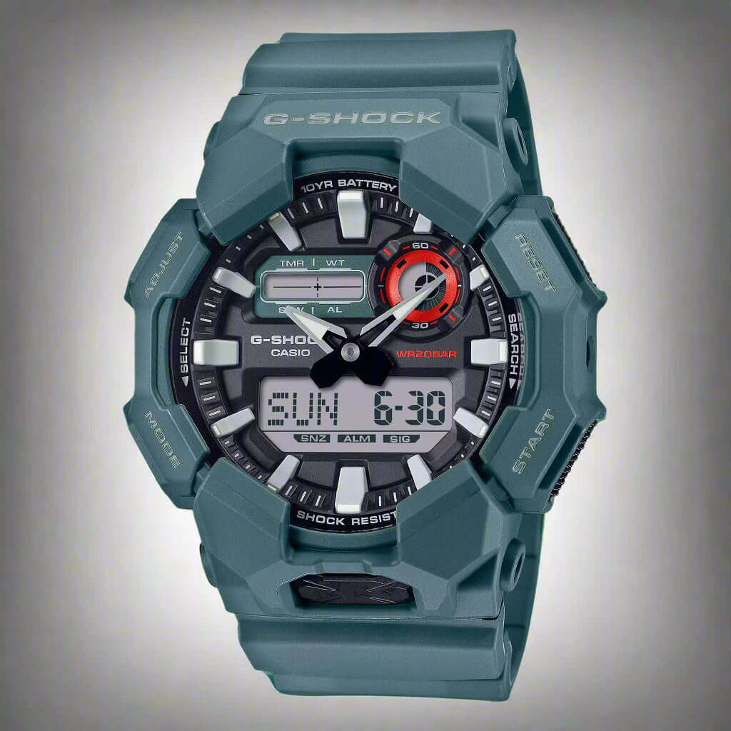 G-Shock watch with green case on a white background