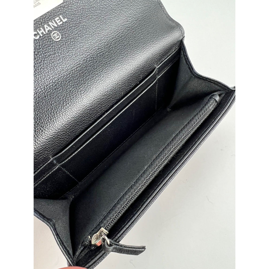 Interior view of Chanel Grained Calfskin Quilted CC Box Flap Wallet showcasing organized compartments for luxury bags.