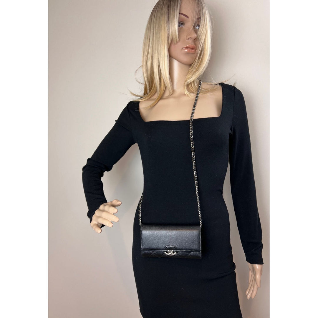 Chanel Grained Calfskin Quilted CC Box Flap Wallet worn on a model, showcasing luxury bags style and design.