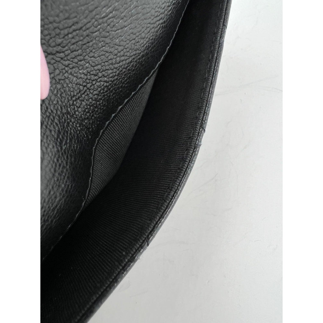 Interior view of Chanel Grained Calfskin Quilted CC Box Flap Wallet showcasing the black grained leather texture.