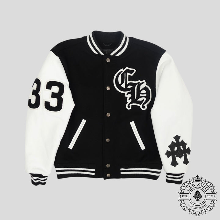Black and white varsity jacket with logos on a gray background
